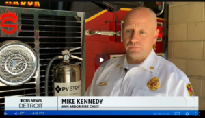 Mike Kennedy Fire Chief Ann Arbor with Fire Truck in background