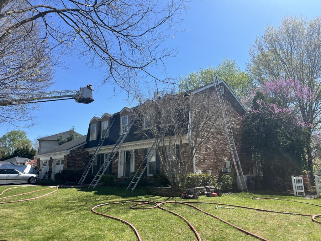 Montgomery County firefighters at the scene of a rooftop solar panel fire in Olney, Maryland.